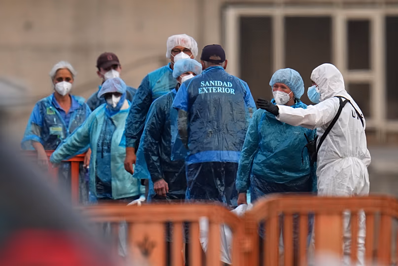 Passengers are disembarked from the hantavirus-stricken cruise ship MV Hondius at the port of Granadilla in Tenerife, Canary Islands, Spain, Sunday, May 10, 2026