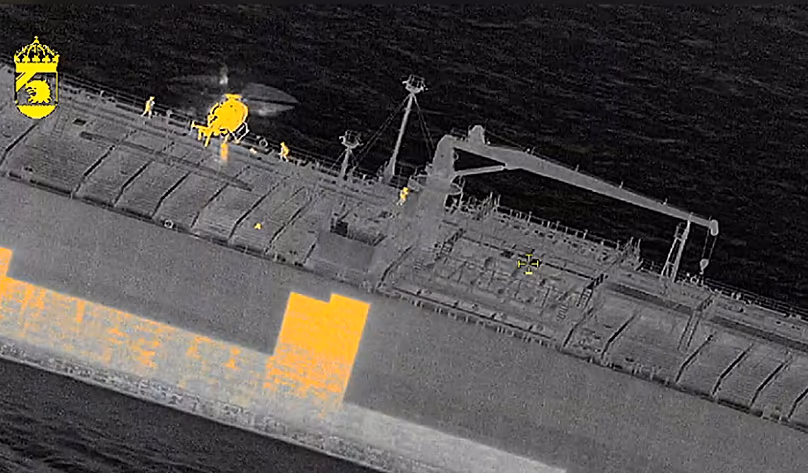 In this image made with a thermal imaging camera Swedish officials board the tanker "Sea Owl I" off Trelleborg, 12 March, 2026