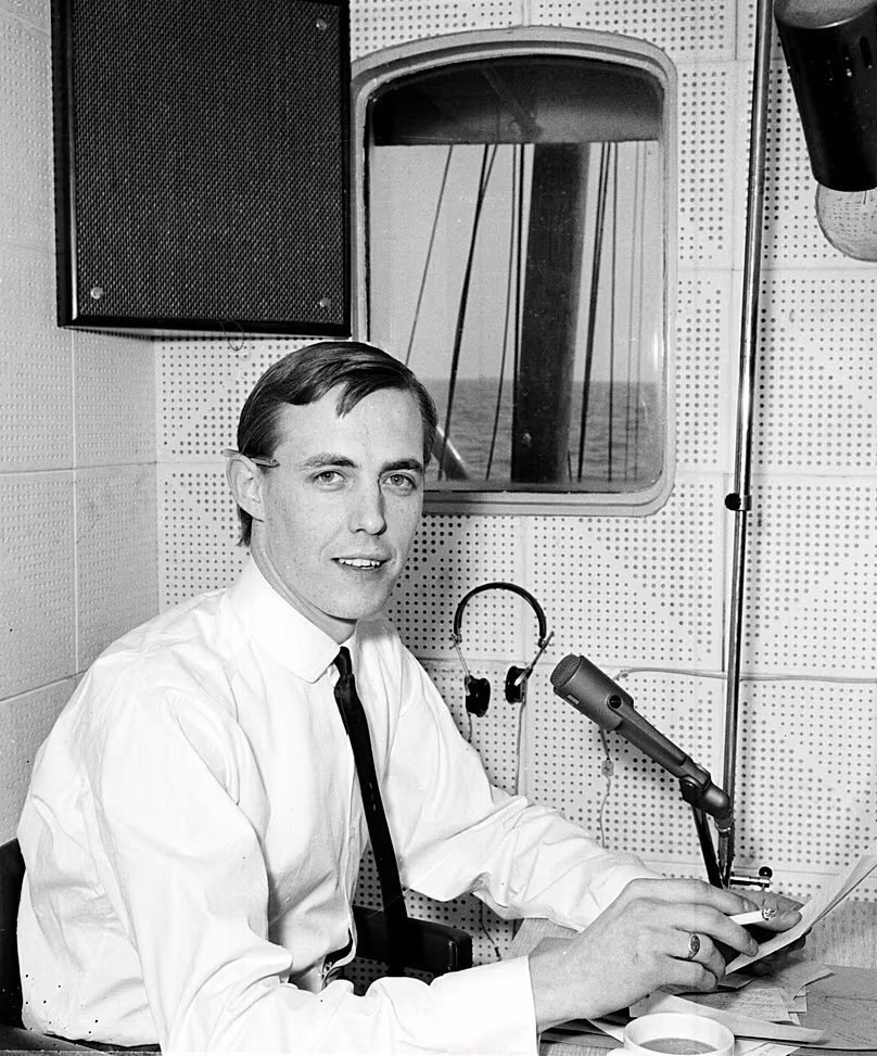 Canadian-born disc jockey Simon Dee broadcasts on Radio Caroline onboard a ship moored in international waters off the English East coast, 14 April, 1964