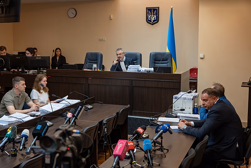 Former Ukrainian president's chief of staff, Andrii Yermak, right, is seen during a court hearing in a city court room in Kyiv, Ukraine, Tuesday, May 12, 2026. 