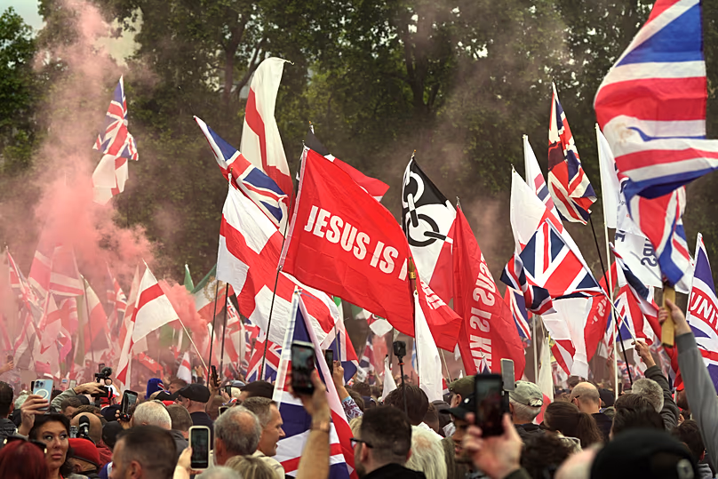 Protesters with flags gather during the far right Unite the Kingdom march in London, Saturday, May 16, 2026.