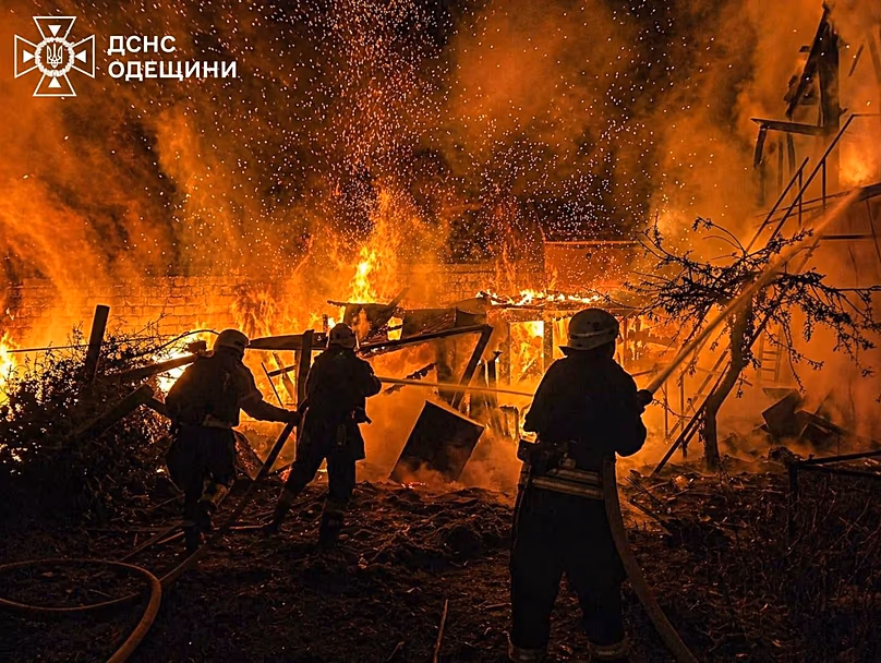Rescue workers put out a fire of a residential building destroyed by a Russian drone strike on Odesa region, 29 April, 2026