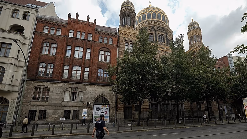 A police officer patrols in front of the "New Synagogue" in Berlin's city centre.