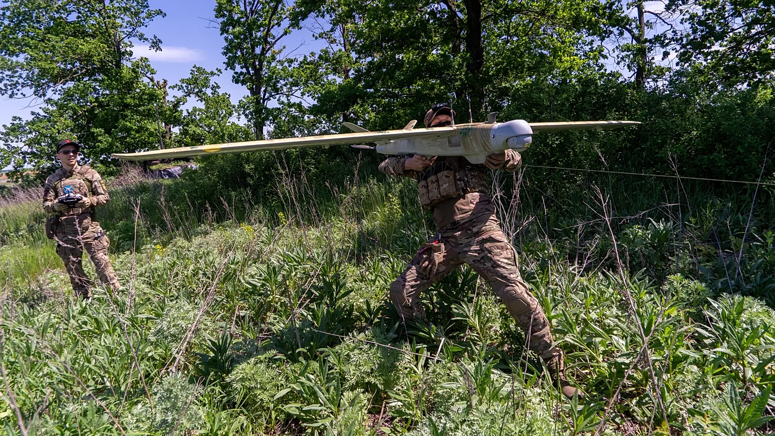 Ukrainian servicemen of Khartia brigade launch a drone towards Russian positions at the front line in the Kharkiv region, Ukraine, Wednesday, May 20, 2026.