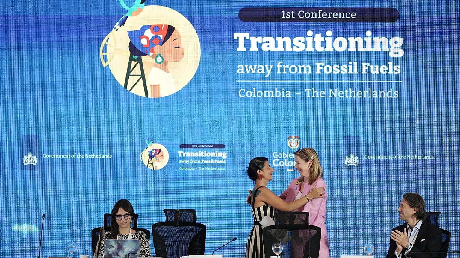Stientje van Veldhoven, Minister of Climate Policy and Green Growth of the Netherlands, right, embraces Colombia's Environmental Minister Irene Vélez Torres.