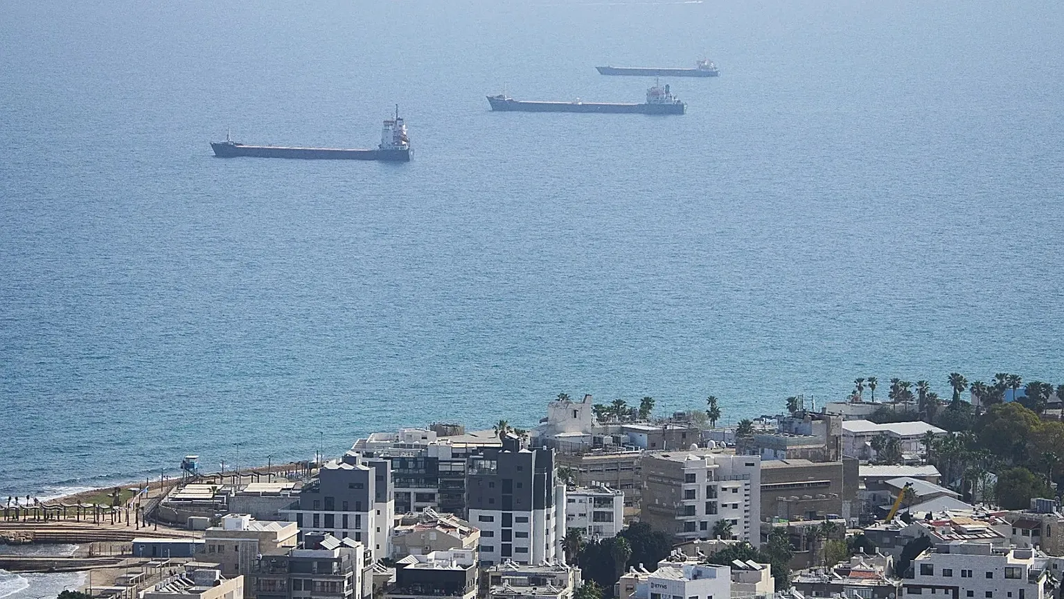 FILE: Merchant ships wait outside Haifa's port, Israel, Wednesday, April 9, 2025.