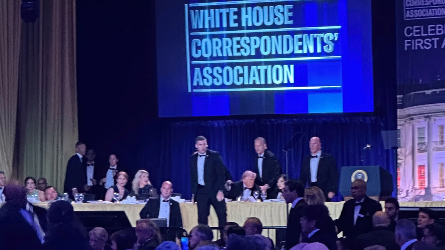 US Secret Service agents surround President Donald Trump after a shooting incident during the White House Correspondents Dinner, 25 April 2026