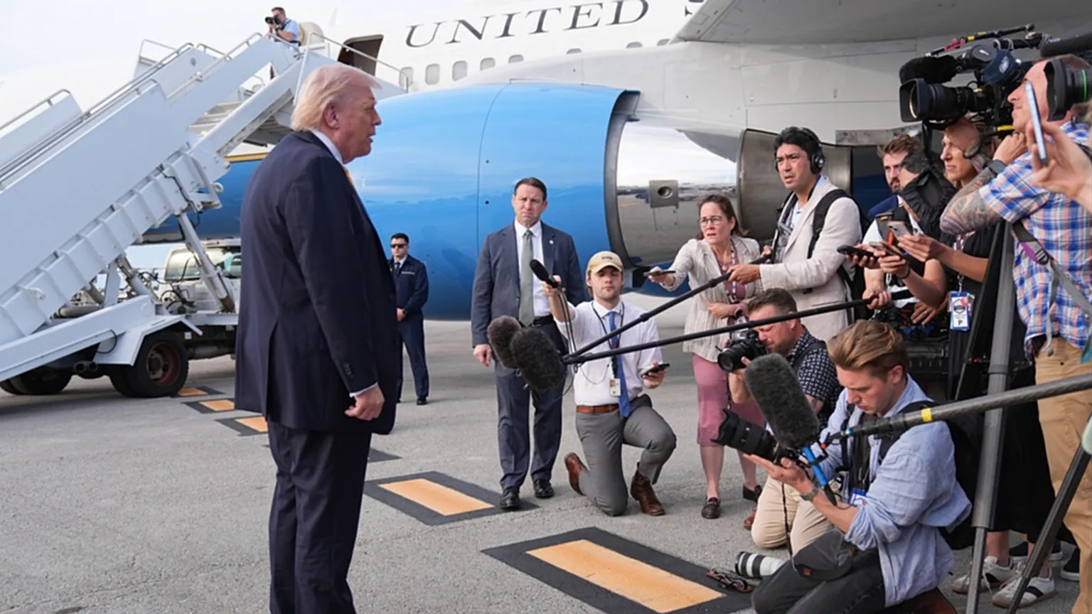 US President Donald Trump talks to reporters before he boards Air Force One at Palm Beach International Airport in Florida, en route to Miami, Saturday May 2, 2026