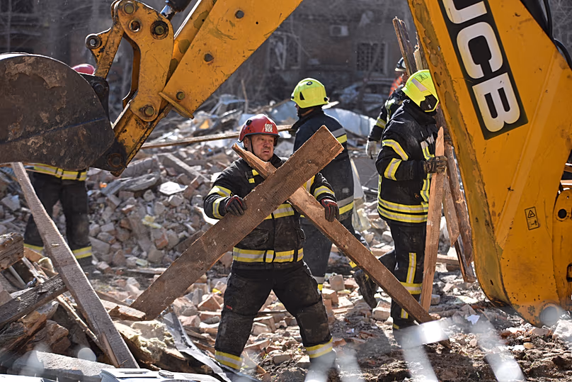 A rescue worker clears the rubble after a Russian strike on a residential neighbourhood of Dnipro, Ukraine, Saturday, April 25, 2026