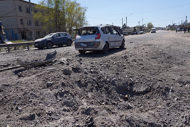 A crater is seen in a residential neighbourhood following a Russian missile attack in Merefa, 4 May, 2026
