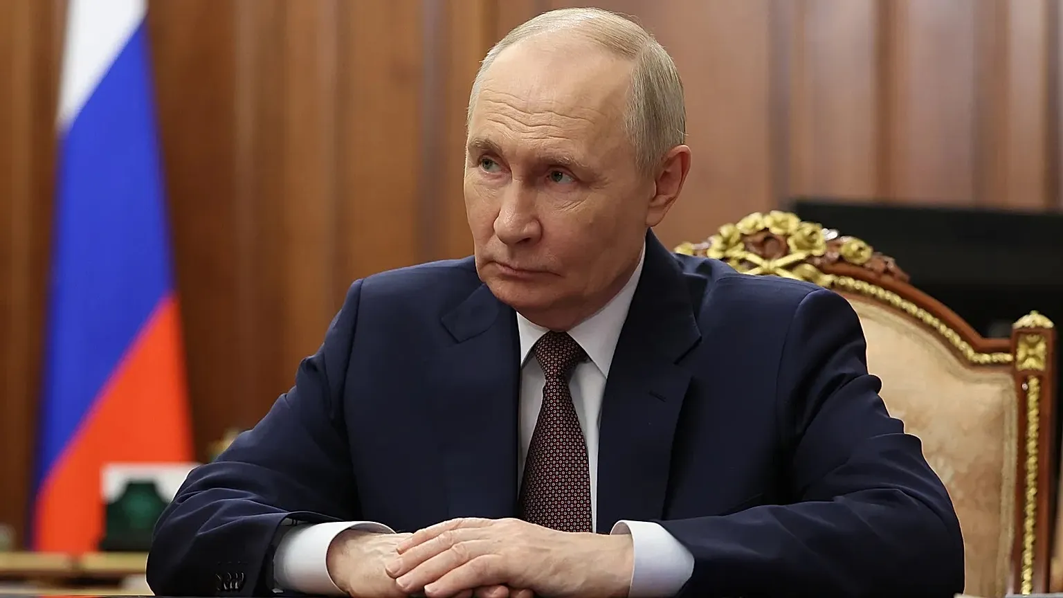 Russian President Vladimir Putin listens to Omsk Region Governor Vitaly Khotsenko during their meeting at the Kremlin in Moscow, Monday, May 25, 2026. 