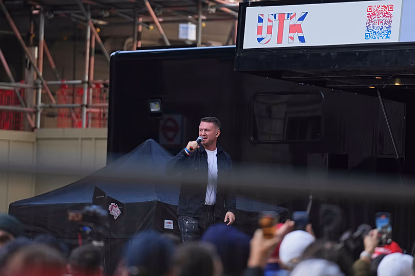 FILE - Tommy Robinson speaks during the Unite the Kingdom march and rally, London, 13 September 2025