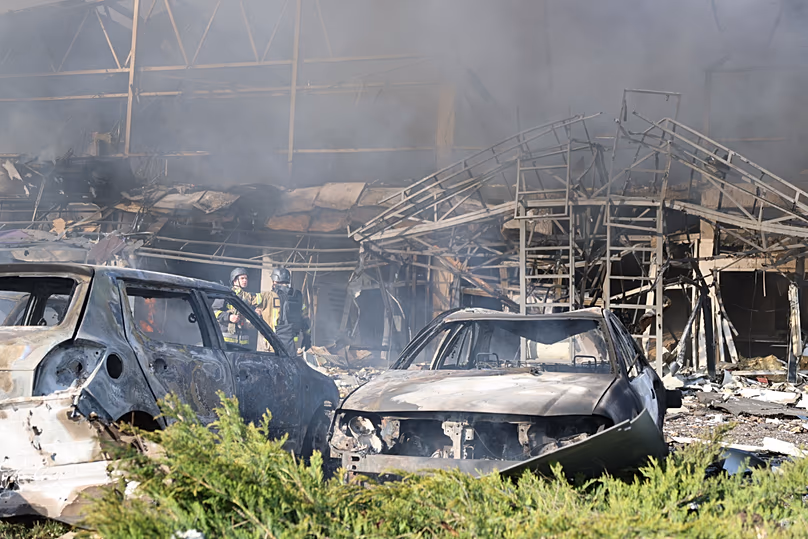 Smoke rises from a car service workshop destroyed by a Russian strike on Zaporizhzhia, 5 May, 2026