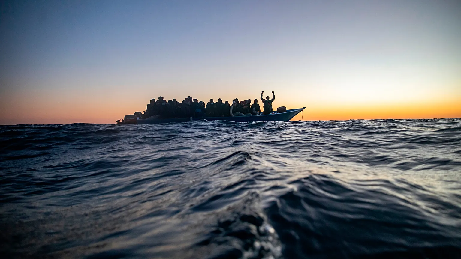 Boat carrying migrants, archive image