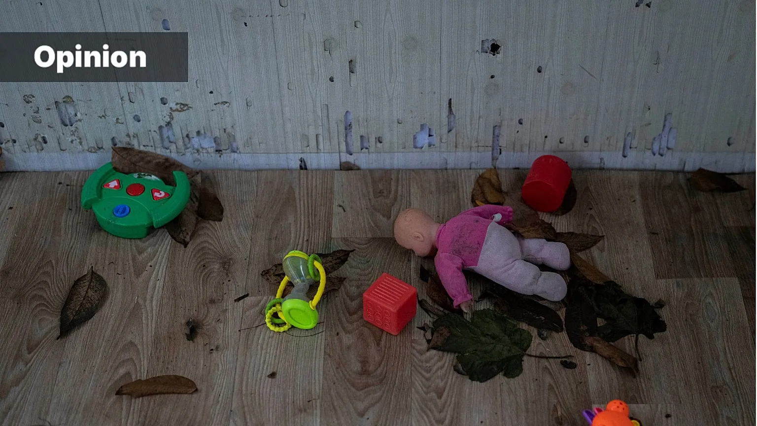 Toys and a doll lay on the floor of a playhouse in the courtyard of Kherson regional children's home in Kherson, southern Ukraine, Friday, Nov. 25, 2022
