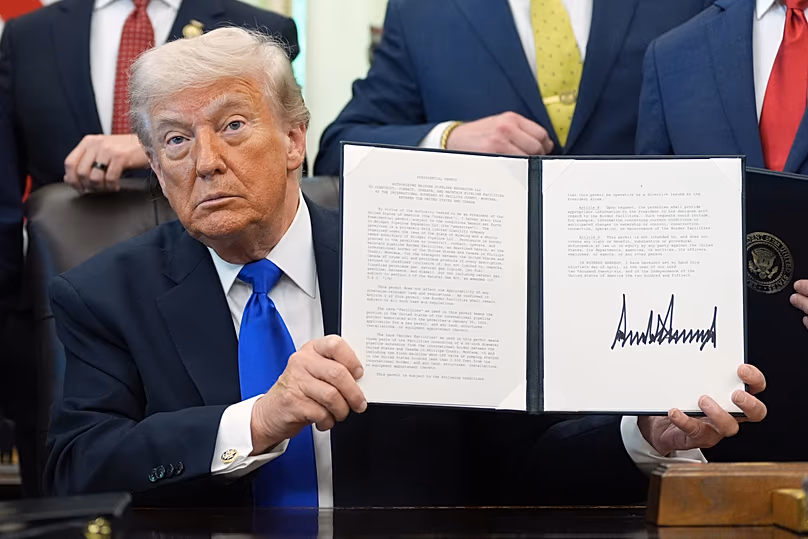 US President Donald Trump signs a presidential permit regarding pipeline construction in the Oval Office of the White House, 30 April, 2026