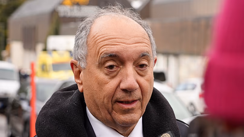 Italian ambassador Gian Lorenzo Cornado talks to the media outside a reception centre near the sealed off Le Constellation bar in Switzerland (AP Photo/John Leicester)