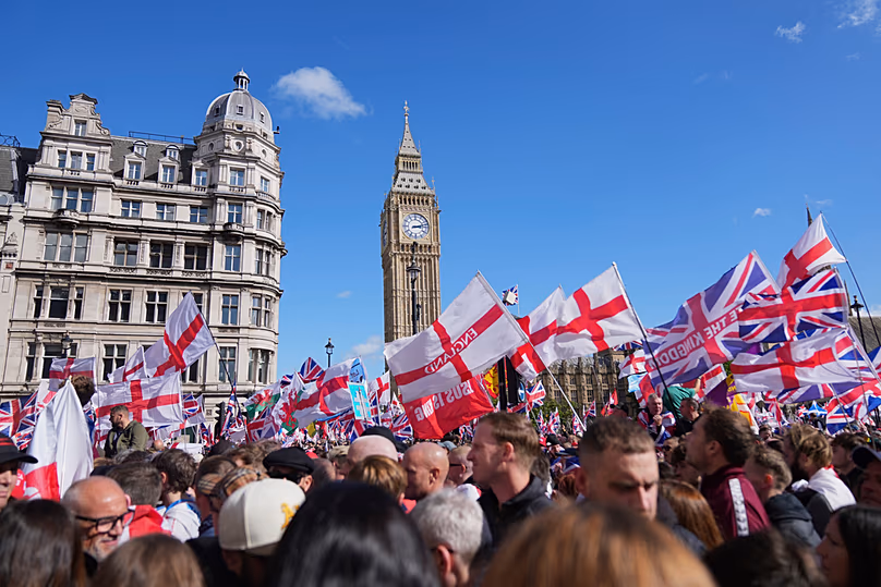FILE - People demonstrate during the Tommy Robinson-led Unite the Kingdom march and rally, London, 13 September 2025