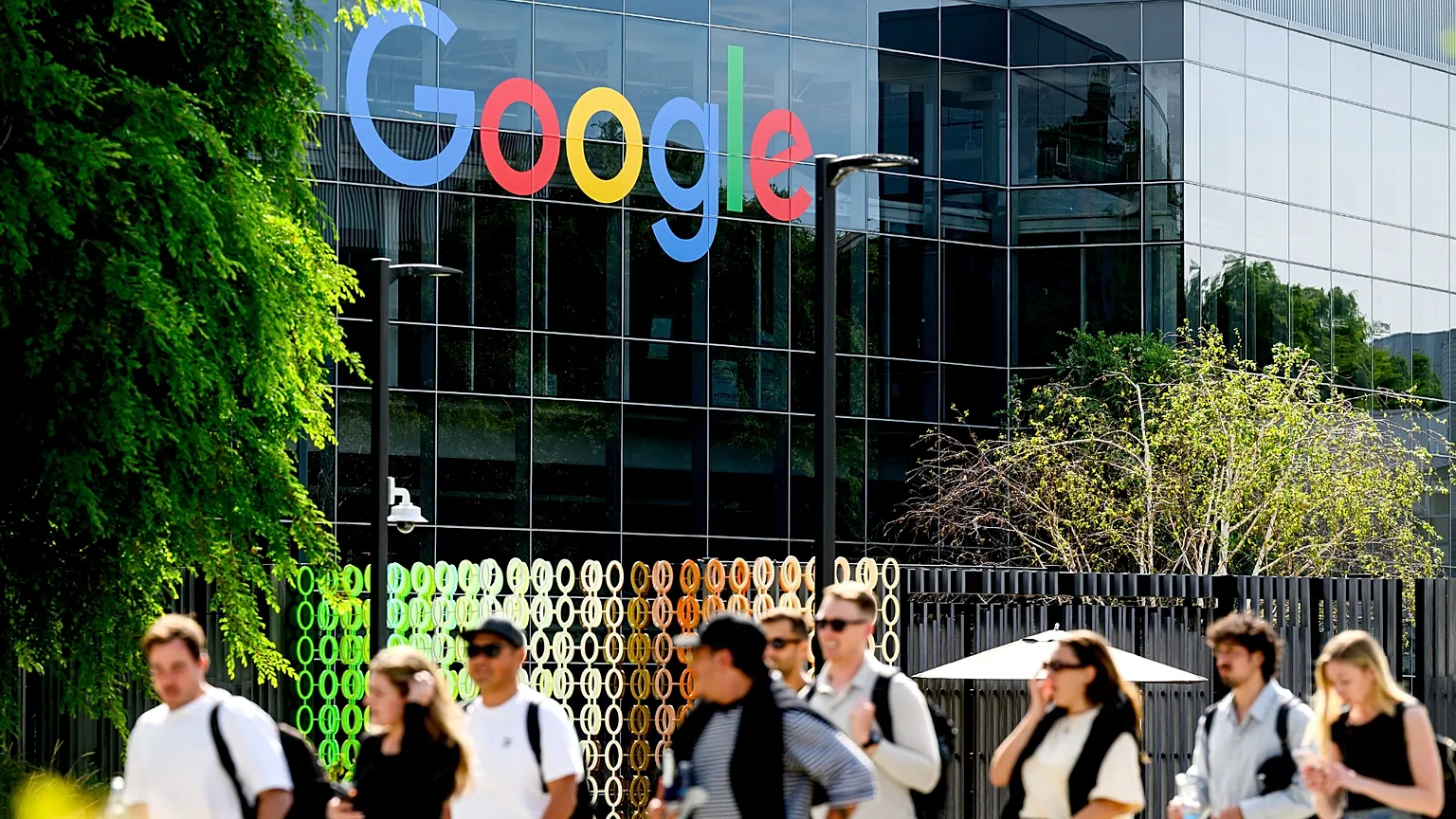 People walk through Google headquarters in Mountain View, Calif., on Thursday, March 26, 2026.