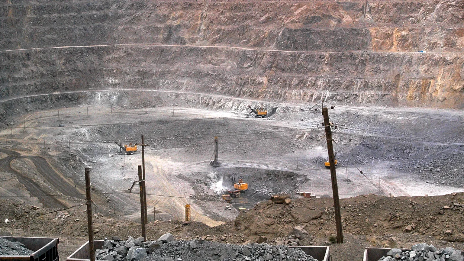 Workers use machinery to dig at a rare earth mine in Baiyunebo mining district of Baotou in north China's Inner Mongolia Autonomous Region, 2010.