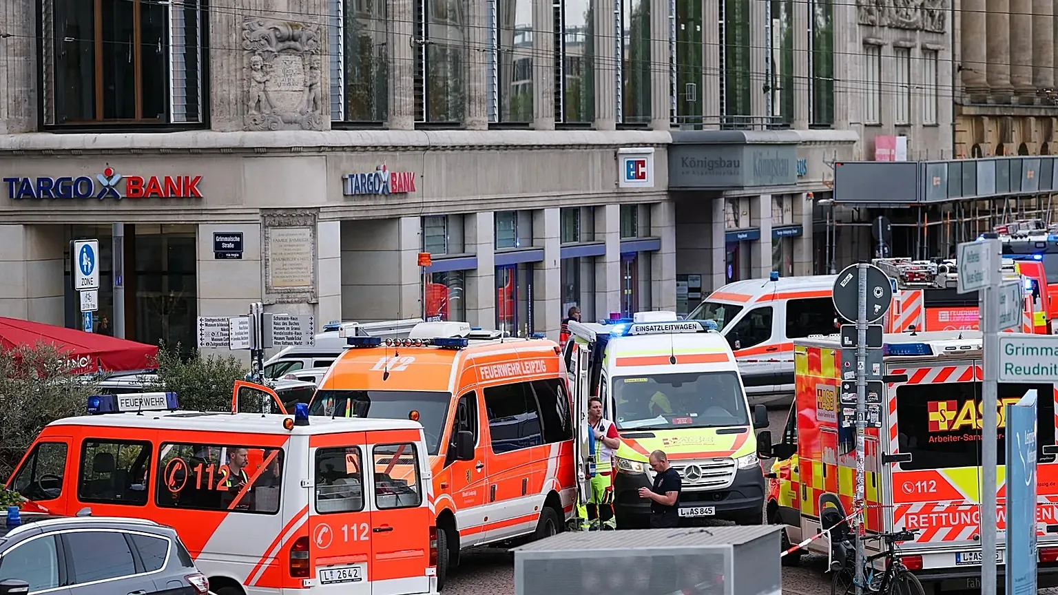 Emergency services stand at the entrance to Grimmaische Strasse after a car crashed into several people in Leipzig, 4 May, 2026