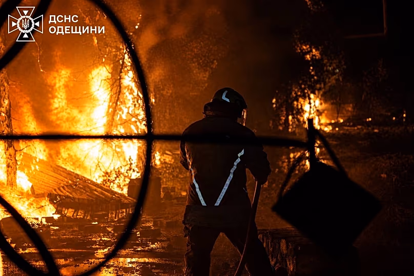 A Ukrainian firefighter puts out a fire after Russia struck the southern Odesa region, 3 May, 2026
