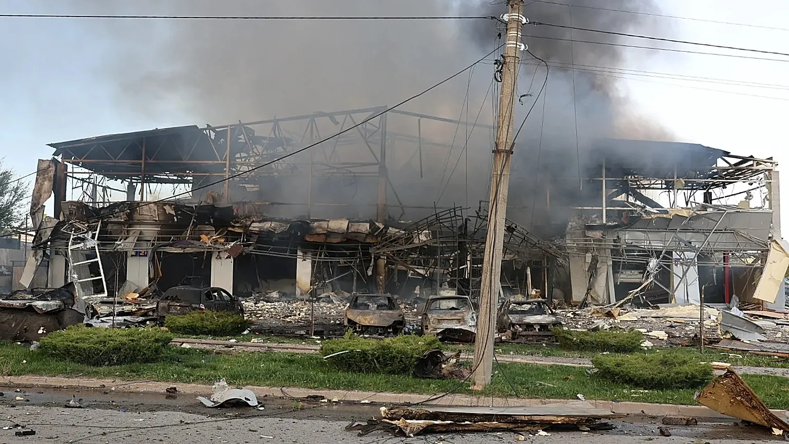 Smoke rises from a car service workshop destroyed by a Russian strike on Zaporizhzhia, 5 May, 2026