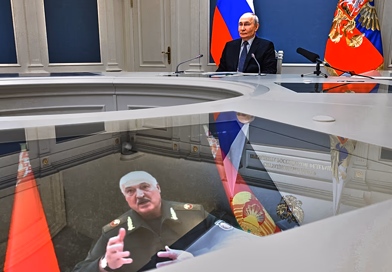 Vladimir Putin and Aliaksandr Lukashenka take part in a video call as part of joint nuclear drills at the Presidential Situation Centre at the Kremlin in Moscow, May 21, 2026