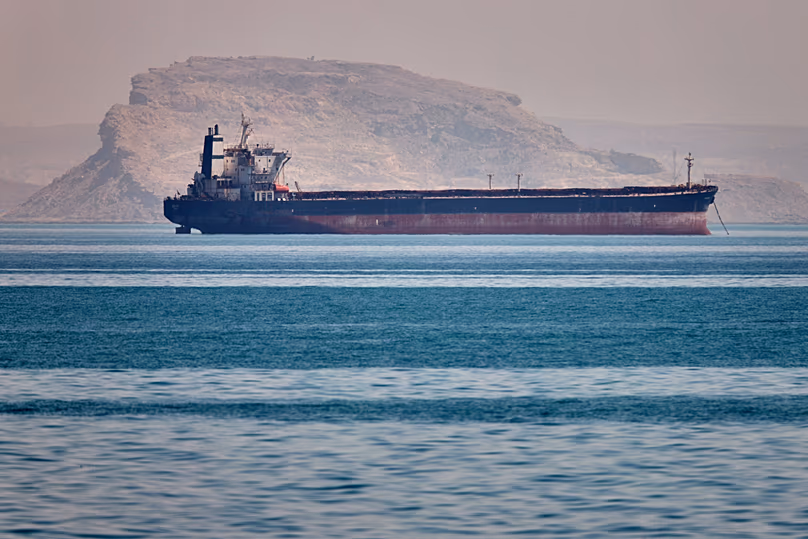 A bulk cargo ship sits at anchor in the Strait of Hormuz off Bandar Abbas, Iran, Saturday, May 2, 2026.