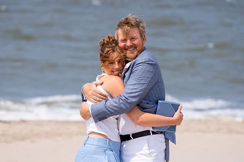Dutch King Willem-Alexander hugs his daughter Princess Alexia as they pose for the media in The Hague, 30 June, 2023
