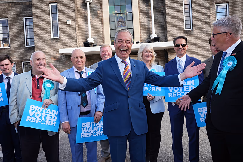 Reform UK leader Nigel Farage poses for a photo during a visit to Havering Town Hall in Romford, 8 May, 2026
