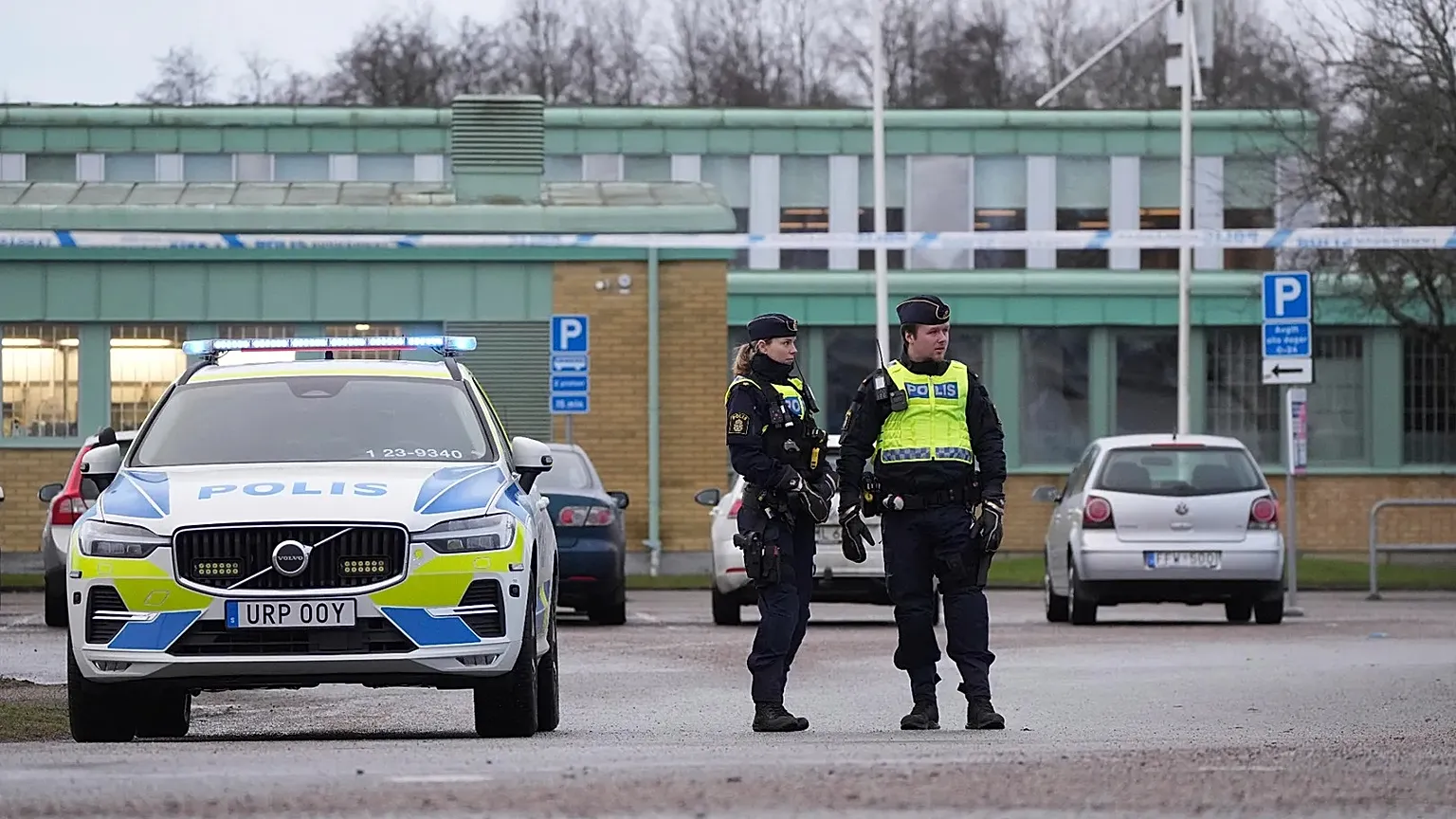 Police officers stand guard near the scene of a shooting at an adult education centre on the outskirts of Orebro, 5 February, 2025