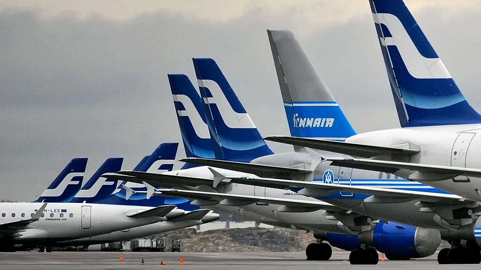 Passenger planes of the Finnish national airline company Finnair stand on the tarmac at Helsinki international airport, 16 November, 2009