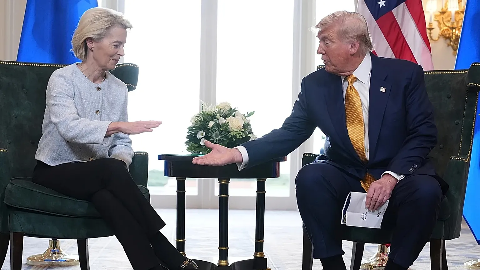 President Donald Trump and European Commission President Ursula von der Leyen shake hands after reaching a trade deal in Turnberry, Scotland, on July 2025