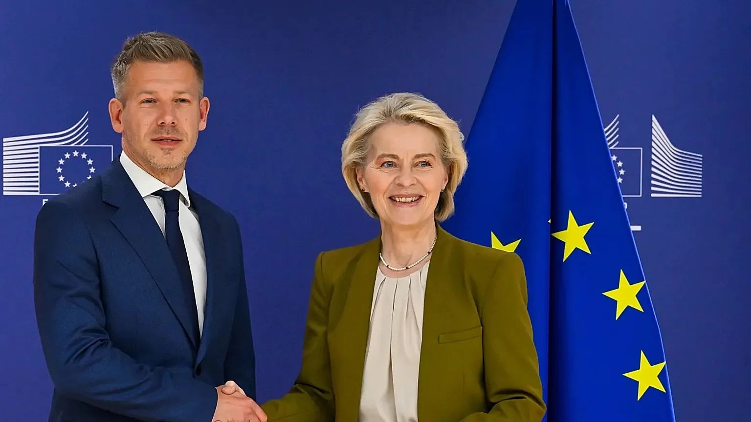European Commission President Ursula von der Leyen, right, greets Hungary's incoming Prime Minister Peter Magyar prior to a meeting at EU heaquarters in Brussels, Wednesday, A
