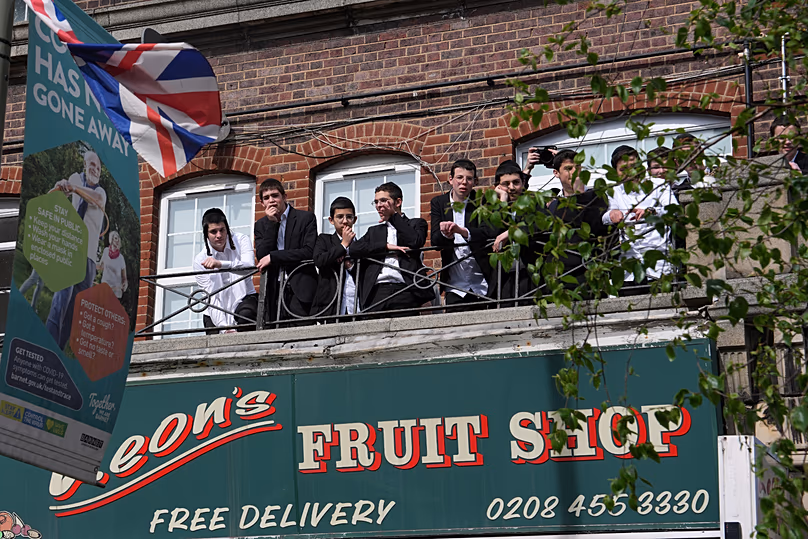 People look over the area where two people were stabbed in Golders Green, 29 April, 2026