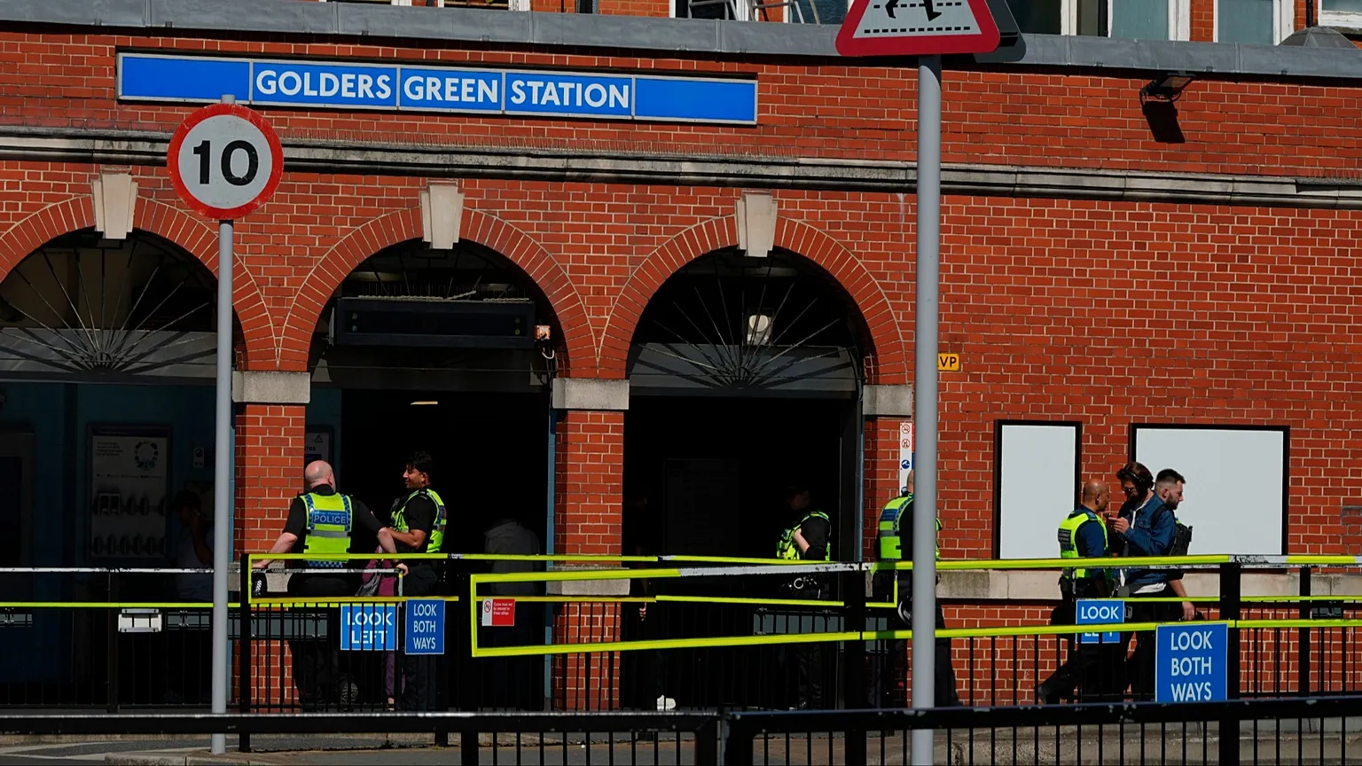 Police on duty outside Golders Green tube station in London, near the scene where two people were recently stabbed, 30 April 2026