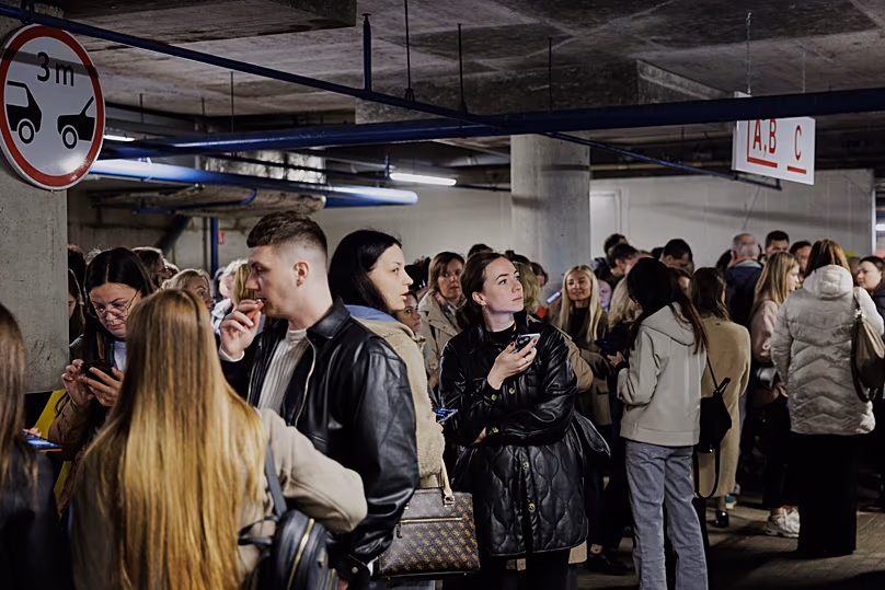 People take shelter in an underground car park during an air raid alert in Vilnius, Lithuania, Wednesday, 20 May, 2026.