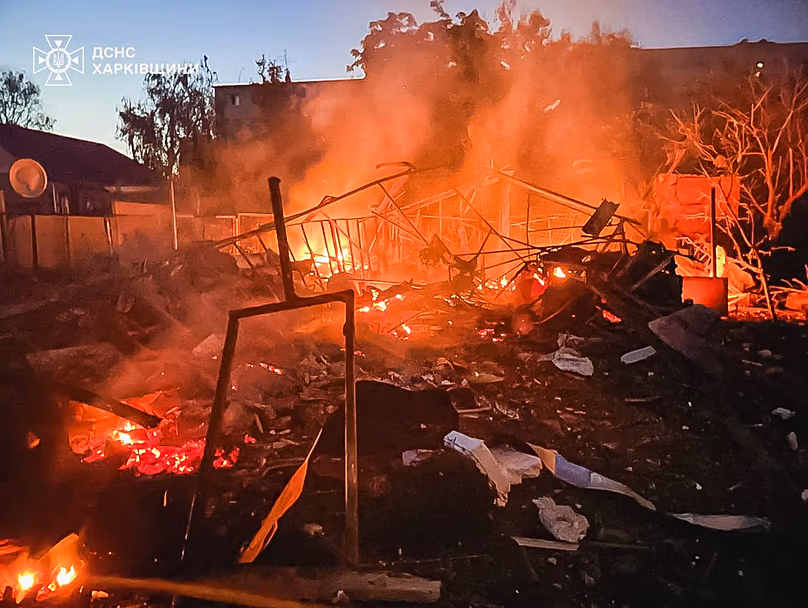 A damaged building burns after a Russian strike in Kharkiv, 9 June, 2026