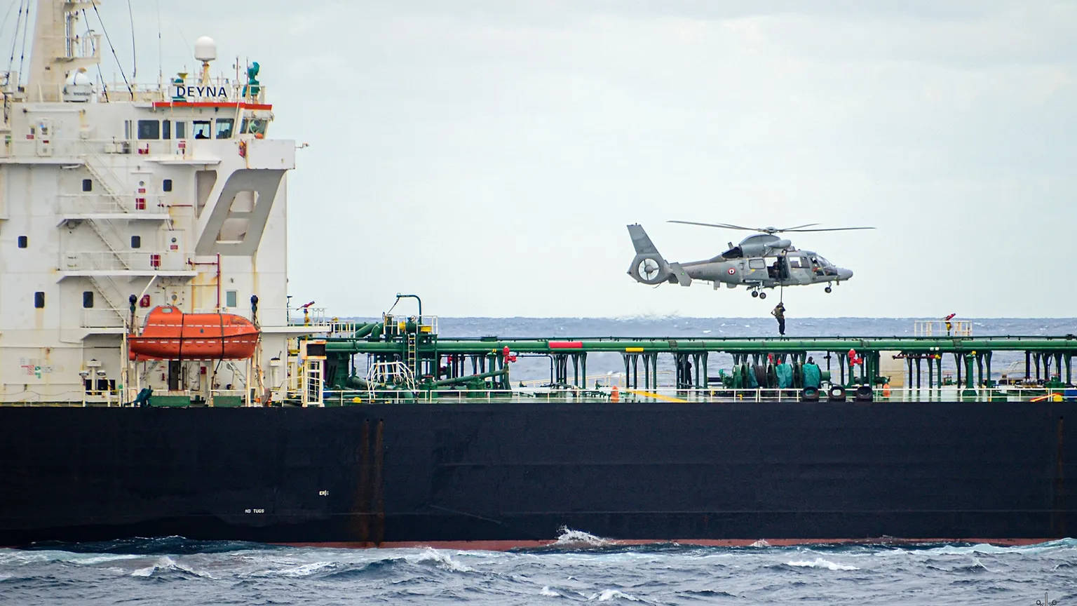 A French soldier rappels down from a helicopter to the Deyna tanker, suspected of being part of Russia's shadow fleet, in the Mediterranean on March 20, 2026