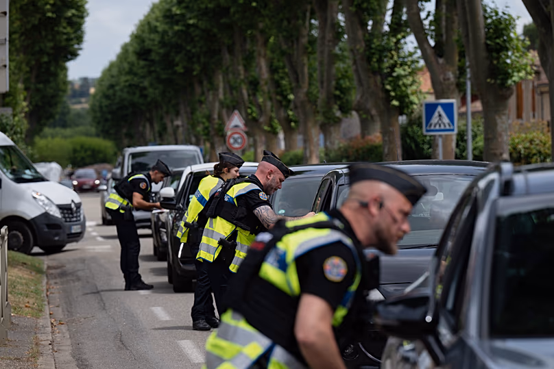 Police inspect vehicles during the search for evidence in the case of missing 11-year-old Lyhanna in Fleurance, 5 June, 2026