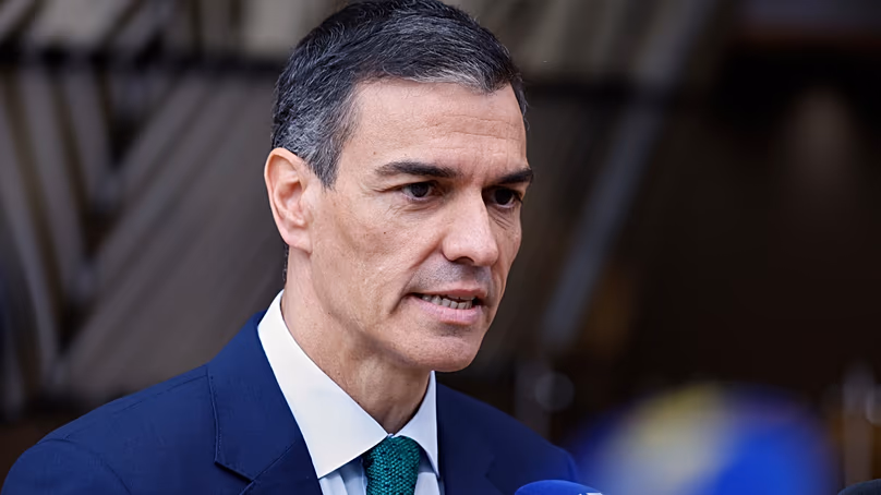 Spain's Prime Minister Pedro Sanchez speaks with the media as he arrives for an EU summit at the European Council. (AP Photo/Omar Havana)