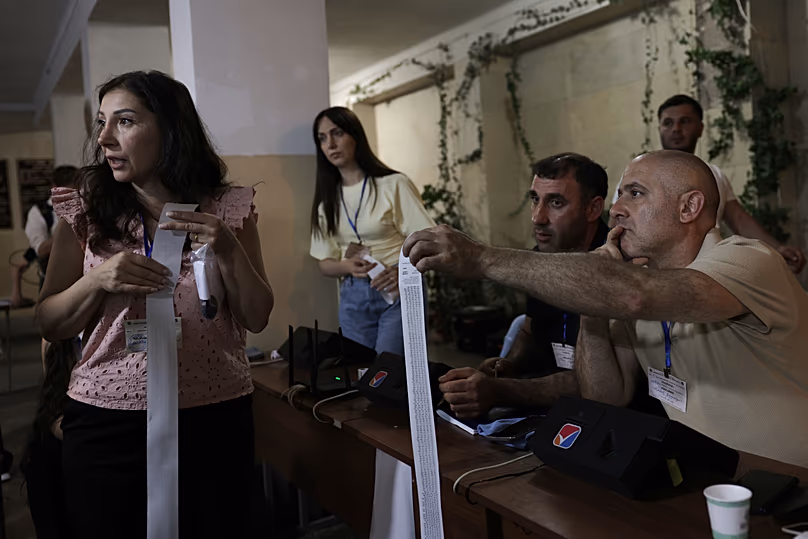 Election commission members prepare to count ballots at a polling stations during a parliamentary elections in Yerevan, 7 June, 2026