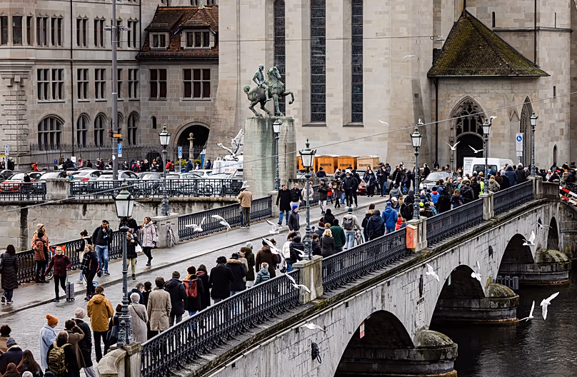 People queue to cast their ballot at the City Hall in a referendum in Zurich, 28 November, 2021