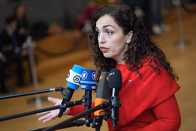 Vjosa Osmani speaks with the media at the European Council building in Brussels, 17 December, 2025