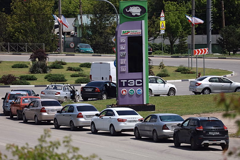 Cars line up at a petrol station in Simferopol, Crimea, Friday, June 12, 2026. 