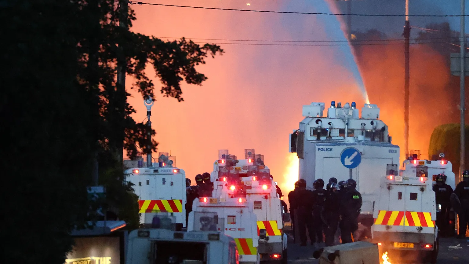 Police attempt to disperse protesters with water canon in Newtownabbey, near Belfast, Northern Ireland, Wednesday, June 10, 2026, demonstrations follow a stabbing in Belfast.