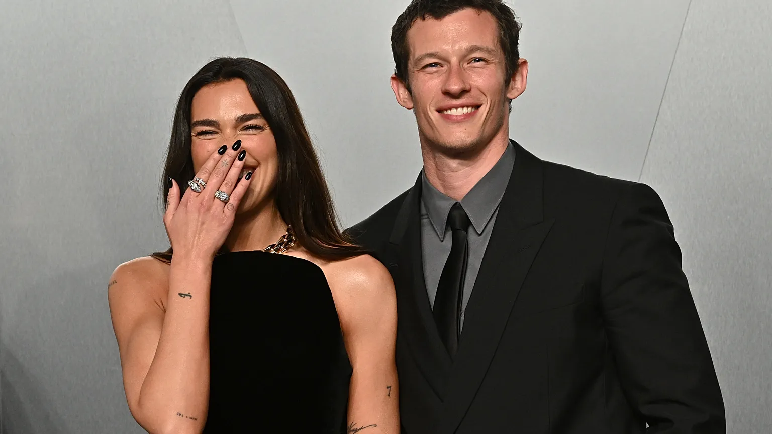 Dua Lipa, left, and Callum Turner arrive at the Vanity Fair Oscar Party on Sunday, March 15, 2026.