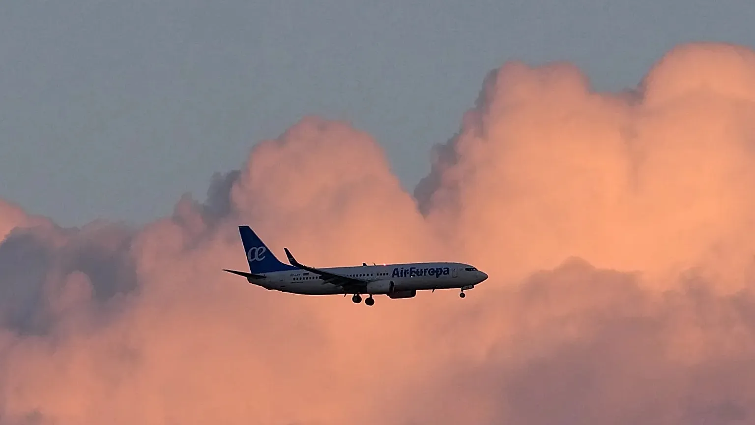 An Air Europa Boeing 737 approaches for landing in Lisbon at sunrise, Monday, May 4, 2026.