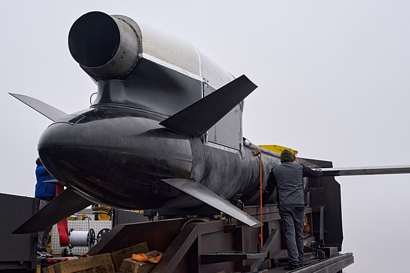 Workers and military inspect Ukrainian Fire Point's Flamingo missiles during handover to the military in an undisclosed location in Ukraine Thursday, Dec. 4, 2025